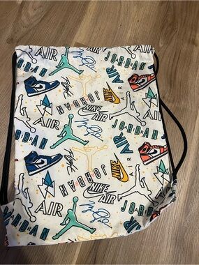 Nike White Drawstring Backpack with Multicolor Air Jordan Graphics